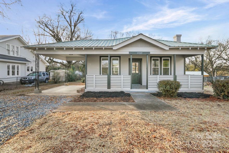 Beautifully remodeled 1932 home blending timeless character with modern living. This charming 3-bedroom, 2-bath residence features Luxury Vinyl Plank flooring throughout the main living areas and a beautiful original decorative fireplace anchoring the living room. The stunning kitchen has been updated with granite countertops, new stainless-steel appliances, new cabinetry, and a tile backsplash, and opens to a large dining area that can serve as a dining room or second living space. A unique flex room off the dining area showcases original wood walls and is ideal for a home office, study, music room, or extra storage. Both bathrooms have been tastefully updated with tile floors, new vanities with quartz tops, and new lighting and fixtures. A huge mudroom, laundry room, and pantry combination off the kitchen adds exceptional functionality. Relax on either the expansive 27-foot covered front porch with ceiling fan or the rear deck—perfect for morning coffee or unwinding in the evening. Conveniently located near Stanly Community College, lakes, parks, and the vibrant Albemarle community, just minutes from downtown Albemarle and approximately one hour to Uptown Charlotte. Schedule your tour today and experience the perfect mix of charm, comfort, and location. Fireplace is decorative only at this point.