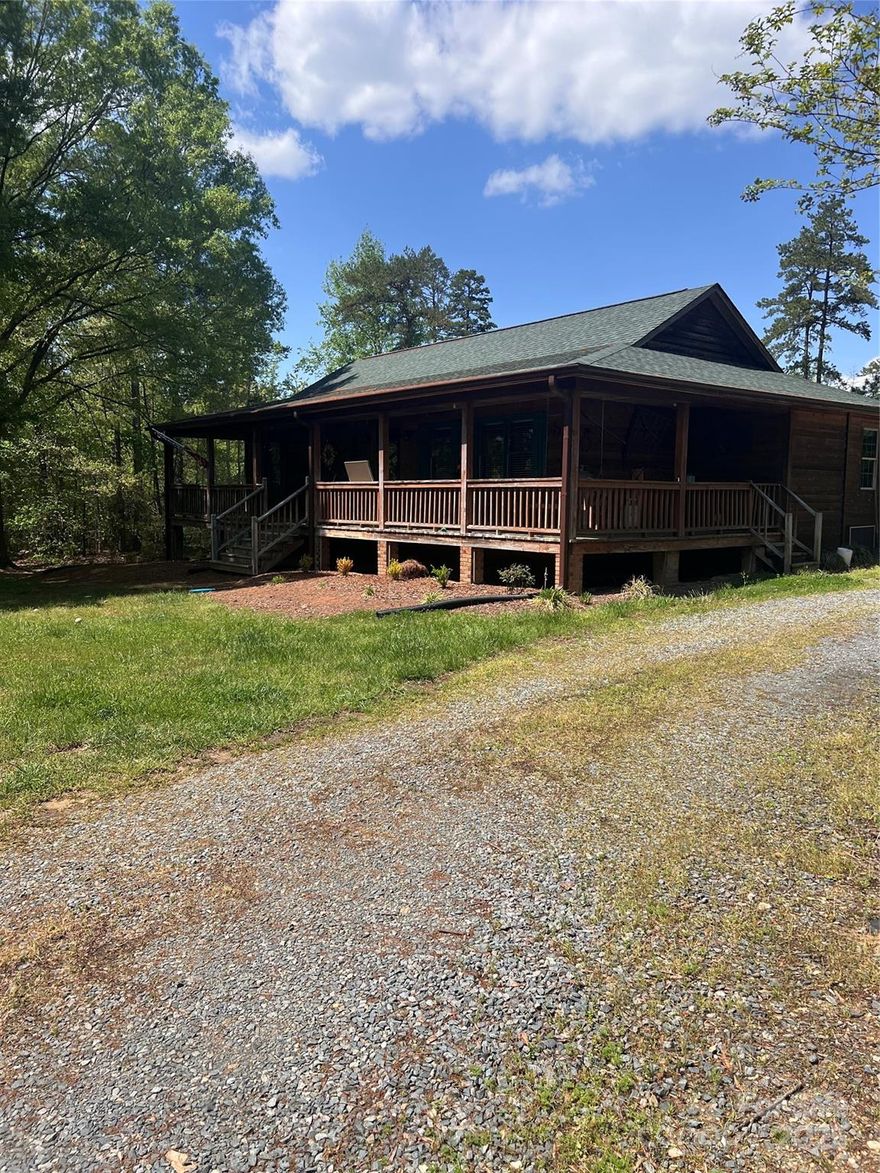 Beautiful wood home giving a cozy log cabin feel in the heart of Locust, NC! With the hustle and bustle of the world, this little slice of heaven is everything you have been looking for. Two bedrooms on the main level with two rooms in the basement used for office/flex space with closets. You will find a large living room on the main level open to the kitchen with a pantry/laundry room. In the basement there is a flex space and another living/play room. Outside you will find beautiful rose bushes and a chlorine pool ready to jump in and beat the heat of NC summers. You don't want to miss this beautiful home.