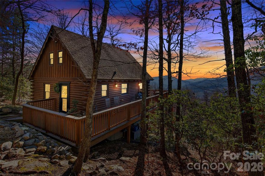 A RARE SECOND OPPORTUNITY.
1909 Linville Drive returns to the market after the previous buyer was unable to complete financing.
Inspections are complete and title work is in progress — offering the next owner a refined and streamlined path to closing. Perched above North Cove Valley with incredible sweeping year-round views of the Blue Ridge Mountains, this fully furnished and extensively updated mountain home offers true turnkey luxury. Nearly every surface has been improved, and the home conveys with a full suite of high-end Restoration Hardware furniture and curated décor.
Inside, the great room welcomes you with vaulted ceilings, abundant natural light, and a striking poplar bark–wrapped, wood-burning fireplace—a rare Appalachian architectural detail that anchors the space with warmth and mountain character. The adjoining dining area features a Restoration Hardware dining table with custom RH chairs and a coordinating RH pendant.
The kitchen includes new appliances, updated flooring, and modern lighting. Both bathrooms—upstairs and down—have been fully remodeled with clean, contemporary finishes. Additional upgrades include new entry doors, new storm doors, black-framed rear doors, new lighting throughout, new carpet in the main-level bedroom, and new flooring across the basement level.
The lower level has been enhanced with new baseboard heaters, an added closet, and a reinforced deck engineered for a hot tub, creating the perfect setup for evening relaxation beneath the mountain sky.
Outdoor living is exceptional: a poplar bark entryway, custom laurel branch railing, wraparound decking, new exterior lighting, and composite patio furniture complete the mountain lodge feel. The property also features two separate driveways, offering ample parking for residents and guests alike.
This community does allow short-term rentals, making this an excellent opportunity for an Airbnb or vacation rental investment. With its panoramic views, designer interiors, and multiple parking areas, the layout is ideal for guests seeking the perfect Blue Ridge getaway.
A premium furnishings package conveys, including RH living room, dining room, and bedroom pieces and a Crate & Barrel console table—creating a truly sophisticated, move-in-ready mountain retreat.
Luxury, craftsmanship, and panoramic mountain views combine to make 1909 Linville Drive a rare offering—perfect as a full-time residence, second home, or high-performing short-term rental.