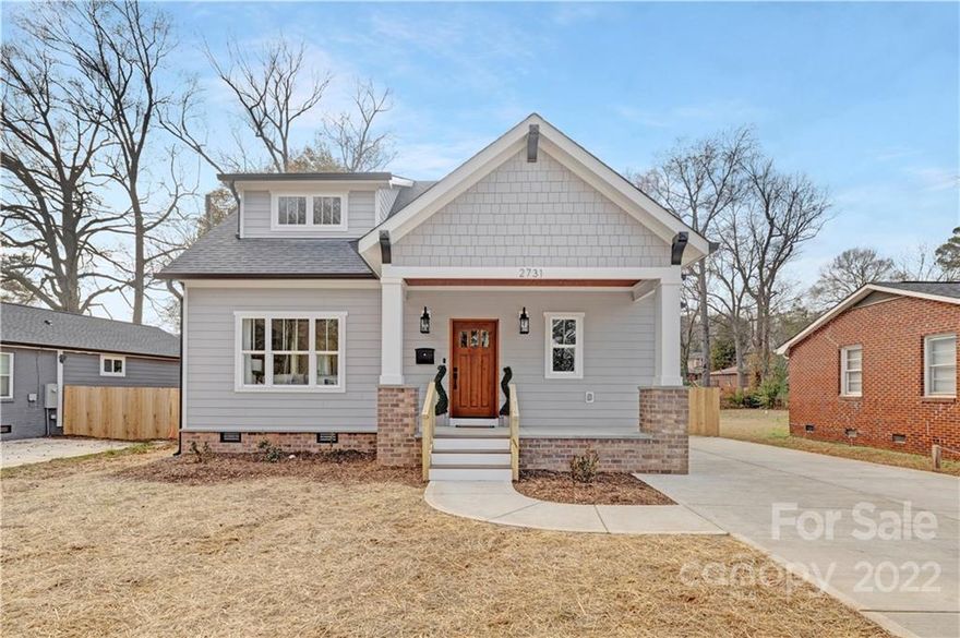 NEW CONSTRUCTION craftsman home near Camp North End and Noda! Open floor plan downstairs with a dry bar off the living room and a chef's kitchen with an oversized island and upscale appliances. Kitchen and bathrooms feature solid wood soft-close cabinets and quartz countertops. Hardwood floors throughout. Modern farmhouse finishes including shiplap walls, a reclaimed wood mantle over the fireplace, wood beams in the living room, and a barn door to the mud room. Full of custom touches and attention to detail! Additional features include Hardie siding, separate HVAC units for each floor, a gas tankless water heater, and a ring doorbell.