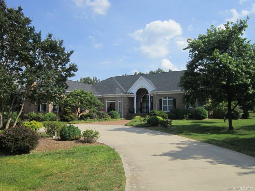 Magnificent custom built ranch home with 12 acres! Grand foyer entry w/columns open to lovely formal LR & stately DR. Tremendous open kit. w/large island & huge breakfast that overlooks GR w/2nd FP & French door to side veranda & patio. Huge master suite w/lg master bath w/whirlpool tub & 2 walk-in closets. Three addit. BRs w/private baths plus 2 half baths. Heavy moldings, detail & character throughout. Oversized 3 car garage. Lovely setting w/beautiful landscaping.