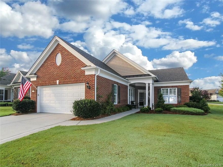 The best of the best!  This Surrey Crest model home with a sunroom sits on a large corner lot with lush landscaping & a 3 season room with EZ breeze windows, tile floor and UV shades-perfect to enjoy the outdoors.  The interior has hardwood floors, crown molding, ceiling fans, plantation shutters, gas stove, pull out drawers, tile backsplash, custom paint, upgraded light fixtures, frameless shower in master bath and much more. Come check out the active adult lifestyle of Sun City Carolina Lakes.