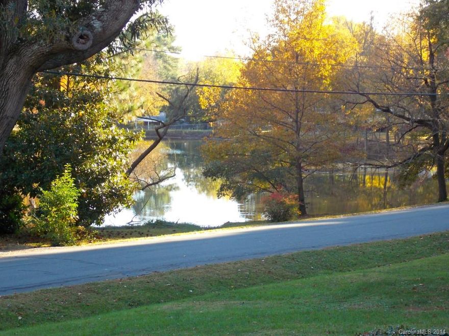 Back with a new look! New carpet and some paint on the inside. Great pond view from across the street! This brick ranch has a great floor plan with an additional living room above the garage. Enjoy relaxing evenings on your spacious deck and large backyard. Ideal location, just a few minutes from uptown, UNCC, I-77 & I-85.  One year home warranty included!