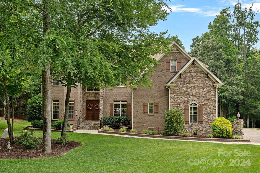 Welcome home to this stunning property nestled on nearly an acre in a quiet cul de sac. Located just minutes from downtown Davidson in the award winning Iredell County school district! Enjoy summer days by the in-ground saltwater pool & hot tub, set amidst a usable lot with no steep hills. Updated HVAC units in 2017 & 2022, roof in 2024, and two tankless water heaters in 2017, plus a whole house water filtration system. Relax in the large sunroom or entertain on the covered porch and patio. Inside features a huge chef's kitchen with all the counter space and cabinetry you could want, a laundry chute making it quick and easy to get all that dirty laundry downstairs quickly on laundry day, and a 3rd floor walk up attic with tons of storage space! This meticulously maintained property is a sanctuary of comfort and modern amenities, perfect for tranquil living. Septic permit is for 4 bedrooms but there are other rooms upstairs that could be utilized as additional bedrooms!