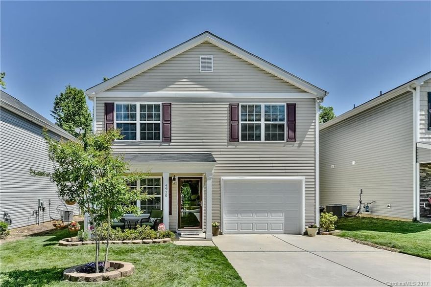 Beautiful!  This spacious home is one of the newer ones on the street and is in impeccable condition!  Large open family room opens to amazing eat-in kitchen w/island and stainless appliances. Ample bedrooms up and deluxe Master suite featuring vaulted ceilings, dual vanity, garden tub and separate shower.  Fenced yard w/patio and rocking chair front porch to enjoy these spring afternoons.  Easy access to University and I485, quiet neighborhood.  Don't miss this beauty!