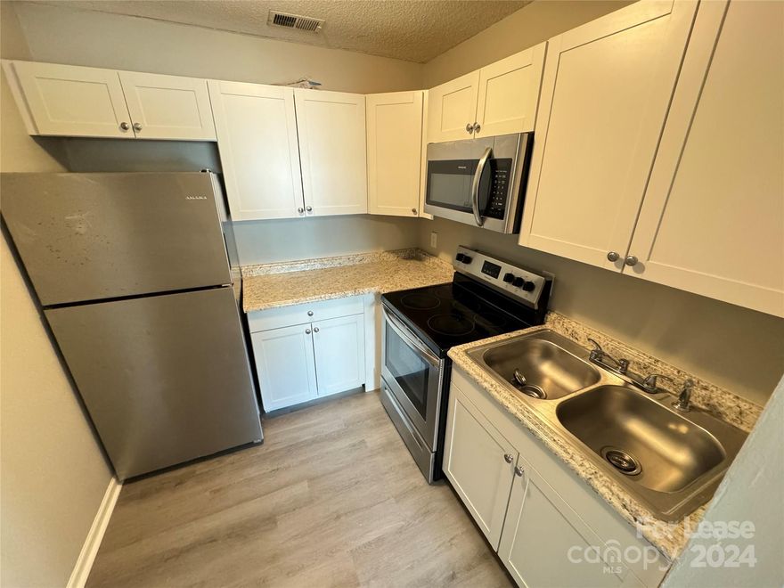 Minutes from downtown Concord this newly renovated and remodeled unit is move in ready. Large living room flows into dining area and kitchen. Kitchen has new counters, appliances, cabinetry, lighting and more. Bathroom is stunning with new vanity and shower surround. Both bedrooms are huge with great size closets. This unit is on the first-floor corner.