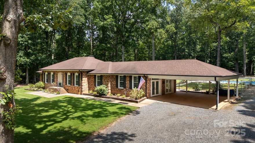 LAND! POOL! NO HOA!  This private paradise features low maintenance brick, pool, wired 2 story workshop! Extra parking,extended driveway create easy access to workshop, gardening,back side property.Double back yard fencing serves as pool safety plus space for pets /entertaining.The primary suite has updated bathroom, large walk in closet plus a second closet. Several areas inside allow flexibility of uses such as a home office, homeschool space, crafting, reading, games space and more!  The large kitchen w/ tons of cabinets plus ample countertop space and adjoins the sunny breakfast room.  Just off the kitchen is the over-sized laundry/mudroom equipped with laundry sink, lots of windows and shelving.  There are 2 attics for plenty of storage. Per seller: HVAC 2020, water heater 2022, well pump and filter 2024, newer flooring, windows, paint,french door to back grilling patio plus back up generator to stay. Home is a RARE opportunity just off Beaty road and minutes to grocery, schools!