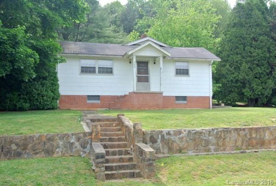 This property has many possibilities- it just needs some love & a good bit of elbow grease to get the ball rolling. Main house has 2 bedrooms,1.5 baths, large kitchen, & 2 living rooms. There is a 2nd space above barn which could be a studio.  4.4  acres (2 PINs combined) for gardening, farming or additional homesites- about 3 acres is wooded. Well has an iron filter & one room has a large wood stove. Property being sold AS-IS & owner is in process of adding a restriction preventing trailers.
