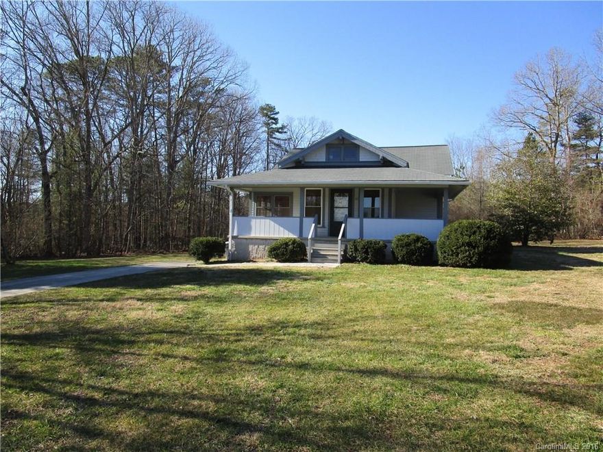 Cute little bungalow style home with lots of charm.  This home features hardwood floors throughout, french doors, separate laundry room, huge dining room/ multi-purpose room, sunny room off of living room would be great office or play room, spacious bedrooms, large covered front porch, huge side yard, over 1/2 acre lot, heat pump only 5 years old, and so much more!  Great price! James & James Environmental manages the community well and it is state regulated.