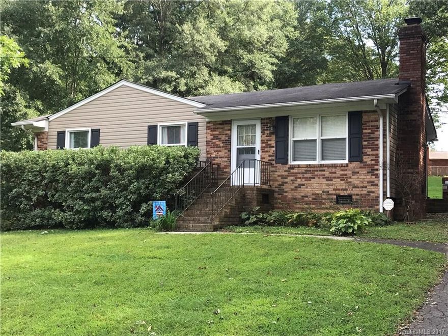 Nice 3 bedroom 2 bath home on almost half an acre lot. Open kitchen, brick fireplace in living room (upholstered brick covering does not convey)... Laminate hardwood floors in living room, kitchen and hall. Carpet in bedrooms, fresh paint in most of the home. Good size storage area attached to the back, nice back yard, trees line one side. Must see to appreciate!
