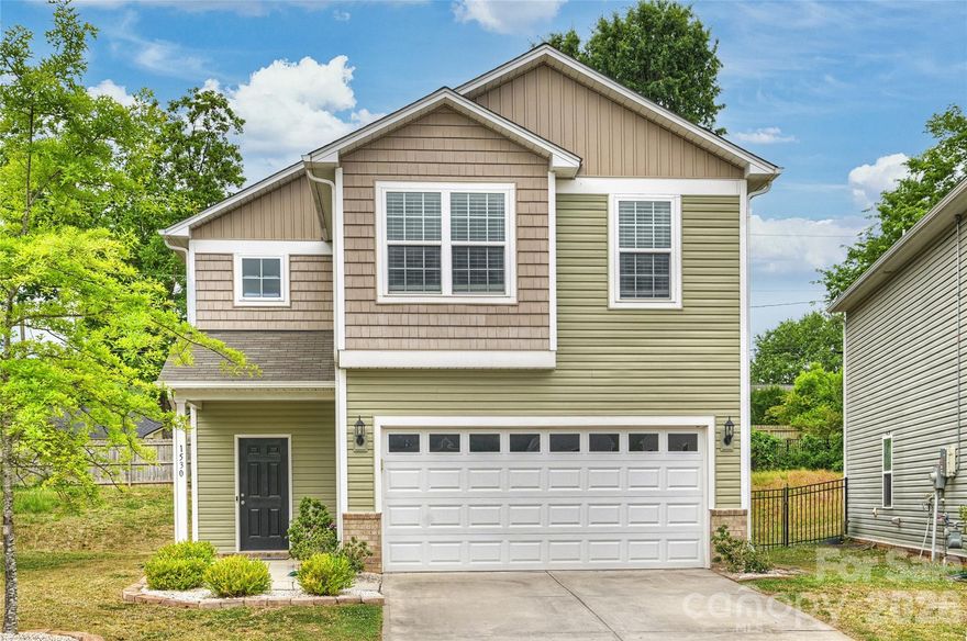 Charming home with modern finishes in Starmount Cove!  Open floor plan is great for gathering with family and friends. Loaded with upgrades!  Main level features vinyl plank flooring, crown molding, and an upgraded lighting package with multiple recessed lights. Beautiful kitchen boasts ample espresso-colored cabinets AND undercabinet lighting, iced white quartz countertops, stainless steel Whirlpool appliance package including 5-burner electric range, extended bartop. Ceiling fans with light packages in living room, ALL bedrooms, and bonus room.  Upstairs, the primary suite with tray ceiling has a walk-in closet with custom closet system. Iced white quartz countertops finish the primary bath with tile floor, shower with shampoo nooks and Listello tile to ceiling. Bonus space currently used as a theater but also makes a great office or playroom.  Two additional bedrooms and a second bath complete the upper level. 2-car garage with Carolina Panthers mural works well for parking or an extra gathering space. Great location minutes from South End, SouthPark, LOSO, and in close proximity to the Arrowood Lynx Blue Line station!  Don't miss it!