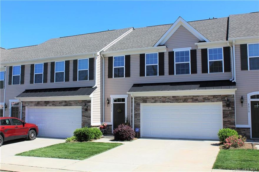 Lovely townhome with engineered hardwood flooring, open and spacious, granite, upgraded stainless steel appliances,custom blinds, beautiful cabinets, soaker tub in master suite.   This home is immaculate and ready to move in.   Private fenced in back yard.