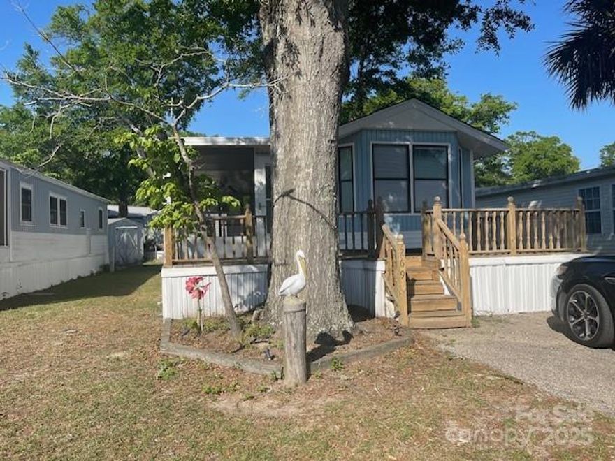 Great opportunity to buy this 2 bedroom 1.5 Bath home WITH deeded land in the desired community of Myrtle Beach RV Resort located in NMB just a golf cart ride away from the beach, resturants, and shopping!!! This gated community offers views of the Marsh, ICW, & Cherry Grove Beach. Low HOA fees include cable, internet, water, trash, lawn care, & sewer. Amentities include 2 pools, hot tub, club house, showers, laundry facility, tennis court, pickleball court, putt putt course, basketball areas, playground, fitness center, game room and more! All personal property in the home will convey. Home needs updating but has great potential!!!! Per seller HVAC new in 2023. Location is directly accross from the laundry area and 2nd pool! Nice large screened porch great for relaxing or entertaining!!!