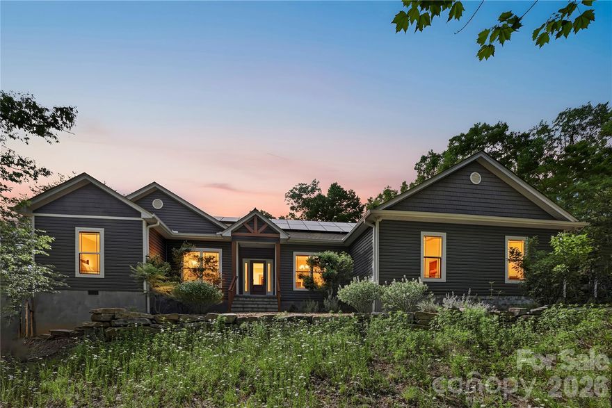 Looking for privacy, modern efficiency, and a standout kitchen in a truly picturesque setting? This newer construction, 3-bedroom, 2-bath home with an office in Tryon checks all the boxes, perfectly situated between Asheville and Greenville, SC. Set among rolling hill country with a pastoral feel, the property offers a peaceful backdrop with several options for stables and horse boarding just minutes away—ideal for equestrian enthusiasts or anyone craving a quieter pace.

Inside, the open-concept layout is anchored by a chef’s kitchen featuring a 48-inch BlueStar gas range and walk-in pantry, with a seamless flow into the main living area for easy entertaining. Each bedroom includes a walk-in closet, while the private primary suite is thoughtfully separated from the rest of the home. A separate laundry room and attached two-car garage add everyday convenience.

Outside, enjoy a flat, well-landscaped yard, a screened-in back porch, and a separate sun deck—perfect for relaxing or hosting—all with exceptional privacy. The home is equipped with a state-of-the-art solar system, helping keep utility costs in check while adding long-term efficiency.