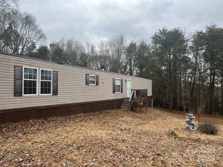 Well Maintained Manufactured home on .98 (gis says 1.02) acre in a country setting! 3 Beds 2 Baths with a large yard, some cleared, some wooded! Private backyard. Home has had some upgrades and had previously been approved for a FHA sale.  Heat pump with a wood burning fireplace.  Two additional storage units, one is 12 x12 and Amish built.  Call for your showing today! Fruit trees and bushes and room for garden spots.