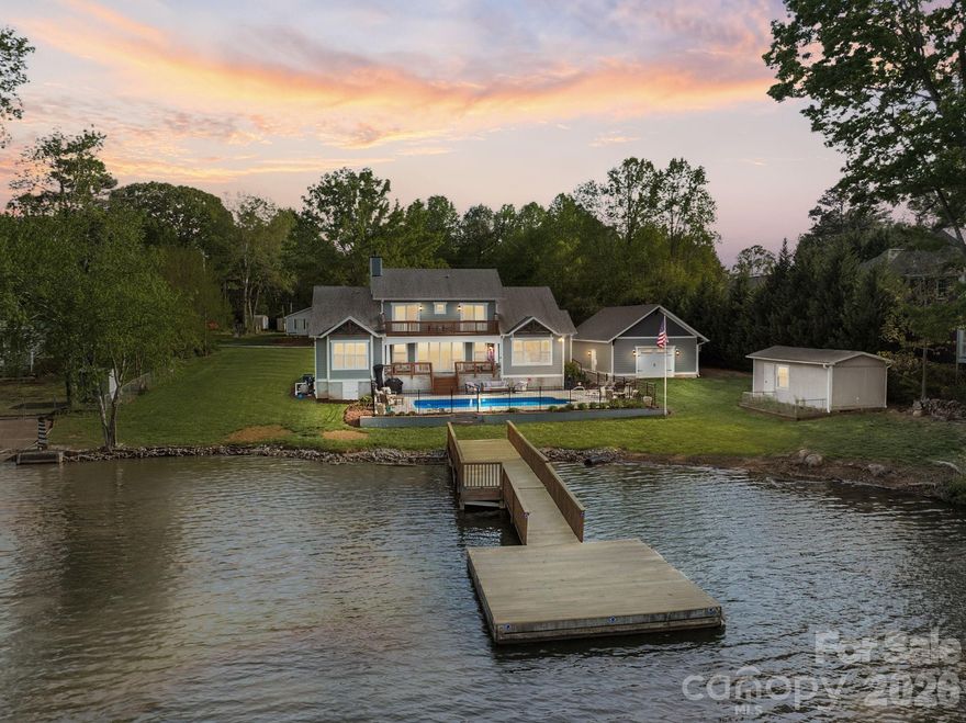 Welcome to this fabulous lakehouse, aptly named Southern Solace, on the main channel of beautiful High Rock Lake! Situated on an extensively landscaped, lush, double lot w/more than 200 ft of lake frontage, a newly resurfaced dock & a saltwater pool. The home features a striking wall of windows overlooking the beautiful view. Perfect as your quiet retreat or entertaining. A chefs kitchen awaits your culinary talents with custom cabinets & quartz countertops. The main level owners suite features electric blinds that open at a touch but offer plenty of privacy. Upper level bedrooms share a bath, a private deck and a large unfinished storage area that would be easy to finish. The detached 4 car garage has a rear garage door making easy access for all your water toys. One of the fastest growing areas of NC, in low tax Davidson County and is convenient to the Triad & Charlotte. You'll love seeing blue herons, eagles, ducks, hummingbirds, great fishing. Agent owned.