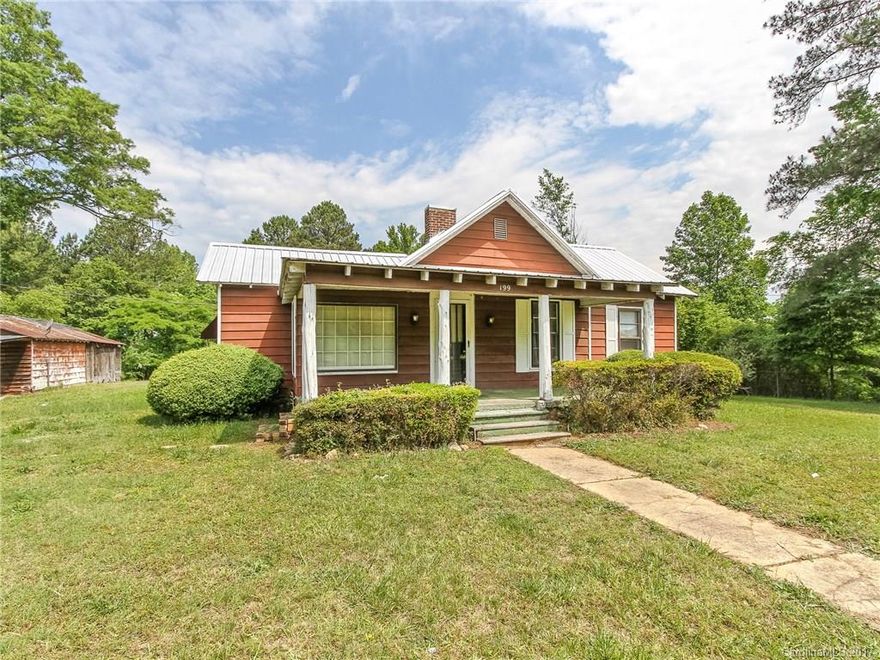 Tons of potential on almost 3 acres! Huge storage building on the property as well. Quaint, country setting just minutes from I-77 and Dave Lyle. Do not miss out on this opportunity!