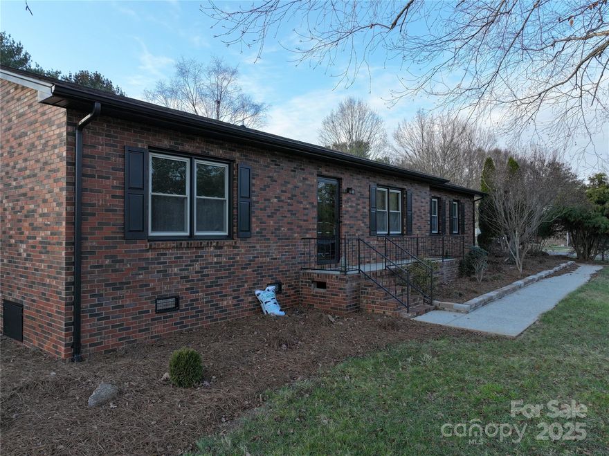 Welcome to 451 James Farm Road, a beautifully updated brick ranch that perfectly combines comfort, style, and convenience. This delightful 2-bedroom, 2-bathroom home, built in 1984, shines with new vinyl plank flooring throughout and boasts a stunningly remodeled kitchen featuring elegant granite countertops.  Conveniently located less than 1 mile from grocery shopping, and just 5 minutes from major shopping outlets, this home offers easy access to all your daily needs while providing a peaceful retreat. Enjoy considerable backyard privacy, making it a perfect playground for family or an ideal space for hosting gatherings.  Benefit from a new Trane heat pump installed in 2022, ensuring year-round comfort in your new home. Step outside onto the spacious deck, surrounded by lush trees, where you can relax or entertain guests in your own outdoor oasis.  Don’t miss the opportunity to make this charming home your own! Schedule a viewing today!