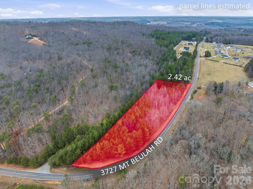 **Seller is offering the buyer a $15,000 credit toward well installation.** Beautiful wooded lot of approximately 2.45 acres located in the highly sought-after Sherrills Ford area. Just minutes from Mountain Creek Park on Lake Norman, offering 606 acres of recreation including trails, fishing, hiking, pickleball courts, and an observation platform. This property is ready for your dream home with two separate 3-bedroom passed perc tests already on file with the county. Situated on state-maintained Mt. Beulah Road with an impressive 841 feet of road frontage. Enjoy easy access to Lake Norman with a short drive to Long Island Lake Access Boat Launch—perfect for boating, fishing, and lakeside fun. A rare opportunity to own a spacious, private lot close to all that Lake Norman has to offer.  Easy access to Hwy 16, convenient to Charlotte and Hickory.