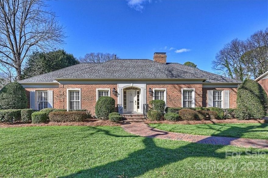 Stately & immaculate brick ranch in sought-after Barclay Downs. This home has the perfect mix of elegance & comfort! Noteworthy features include gorgeous hardwood floors downstairs & up; detailed  millwork; shutters and wood blinds; light, neutral paint throughout; spacious rooms and excellent flow! Primary suite on main level has spacious bedroom, large walk-in closet w/custom storage, and elegant bathroom. Second bedroom makes a nice home office. Kitchen features white cabinetry, stainless steel appliances & sunny breakfast area. Large laundry room off kitchen provides nice additional storage. Beautiful wood-burning fireplaces in living and family rooms. Fabulous sunroom overlooks gorgeous rear yard. Upstairs bedrooms each have direct access to full bath w/double sink vanity. This home has excellent curb appeal & features a private, fully fenced rear yard w/brick patio and a covered carport w/storage room/workshop. Ideal location convenient to schools, shopping, dining & more!