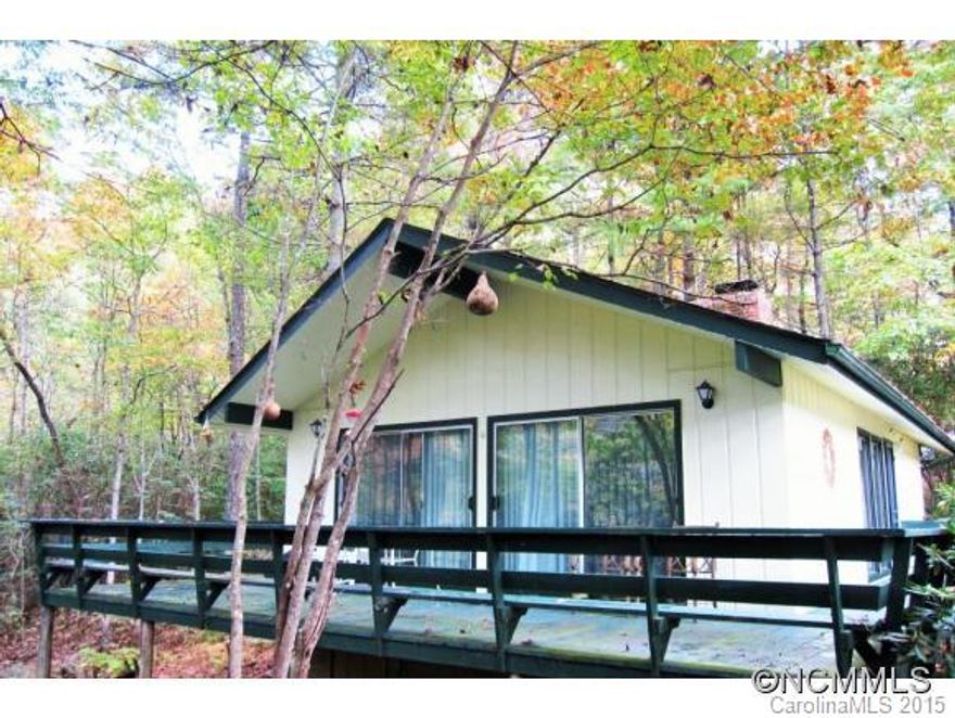 Your mountain getaway. Close to DuPont State Forest, Pisgah National Forest and Downtown Brevard. Cabin has a wrap around porch. The wooded lot has a year around creek on it. Could be a great first home also.