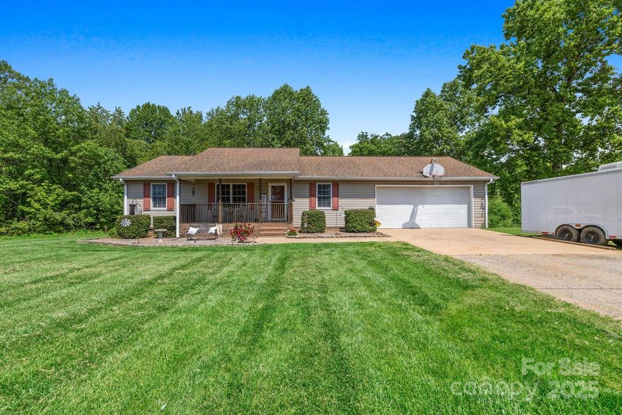 Charming 3 bedroom, 2 bath home in a quiet neighborhood, conveniently located near top-rated schools. Enjoy the spacious living area and bedrooms with generous closet space. Large oversized garage for ample storage or hobbies. The expansive backyard offers room for play and relaxation, while the back porch is perfect for morning coffee or evening barbecues. Close to Love Valley's unique attractions and outdoor activities, this home is a perfect blend of comfort and country living. Appliances to convey with the home. Schedule a tour today!