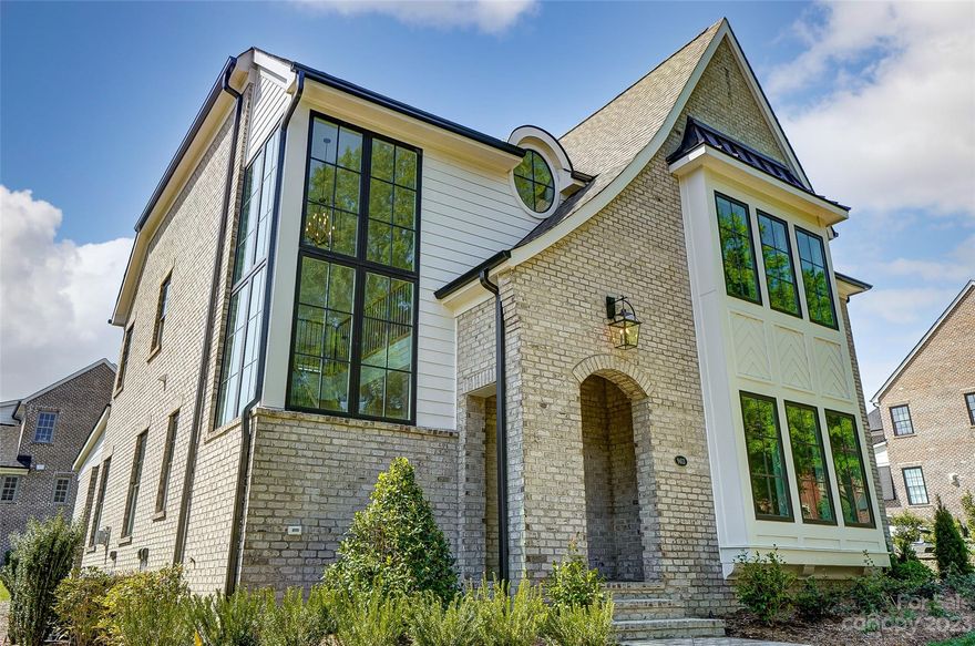 This stunning Heyden Hall property is brand new construction and is equipped with high end appliances, custom 
cabinetry and a breathtaking waterfall island in Natural Marble. This home has a open floorplan that is bathed in natural light. The primary suite is on the main level and has a custom closet and a lovely en suite with separate spacious shower and tub. Upstairs there is a large landing encased in windows creating a bright secondary spot for entertaining. Three bedrooms, each with their own full bath complete the upstairs floorplan. Heyden Hall is a gated  community created by Simonini in highly desirable South Charlotte. Convenient to shopping and uptown Charlotte, this residence is right where you want to be. The customization of this home and attention to every detail  creates a special sanctuary that must be seen to truly be appreciated. HOA dues includes front yard maintenance and irrigation of property.