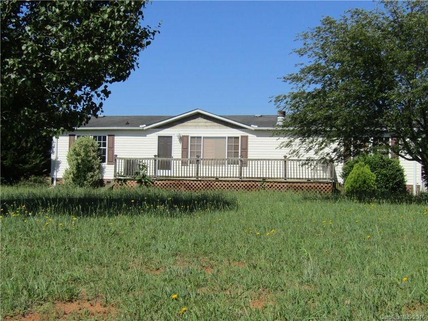 Beautiful backyard views from this 3 bedroom 2 bath manufactured home.  Features fenced backyard, HUGE deck/porch on the front with workshop in the back yard.  This home is minutes from Hwy 279, Hwy 150..makes for an easy commute to Lincolnton, Dallas, Shelby, Gastonia & Cherryville.  Truly a must see!