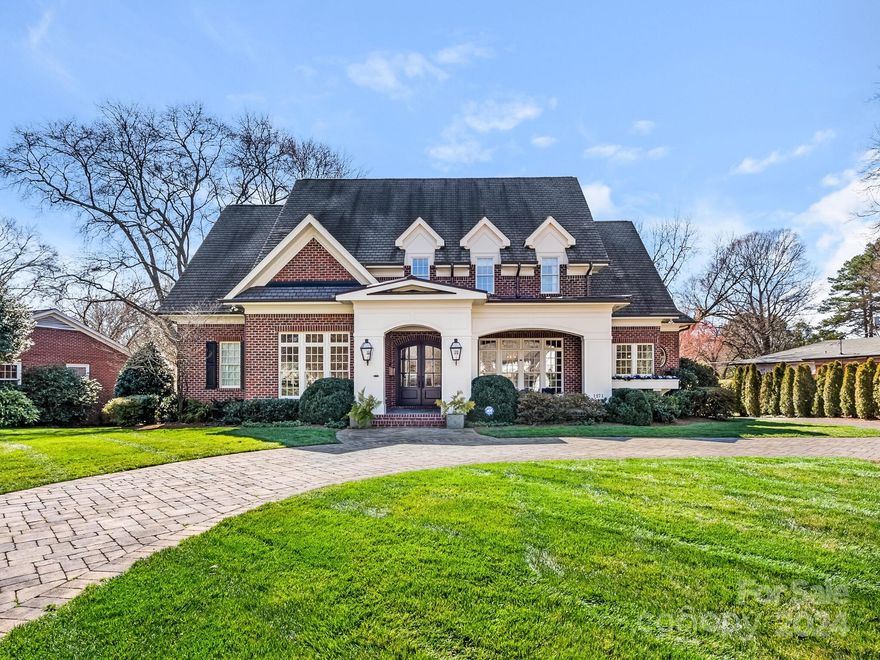 Wonderful home in the heart of Olde Cotswold loaded with detail, charm and curb appeal. Welcoming front porch leads to arched double front entry. Foyer opens to private study with cathedral ceiling and built-in bookcases.  Formal dining room with crystal chandelier. Kitchen with oversized walnut island with prep sink, Wolf gas range, dual ovens, Sub Zero refrigerator. Large walk-in pantry, abundant cabinetry and storage. Breakfast room. Family room with built ins, coffered ceiling leads to screened porch with fireplace. Wet bar with beverage fridge. Private office. Mud room, drop zone. Primary bedroom with tray ceiling opens to porch. Primary bath with heated floors, dual vanities, spacious walk in closet. Upstairs features three additional large, ensuite bedrooms with walk in closets. Huge bonus room with half bath. Second laundry hookup upstairs. Detached 2 car garage with permanent stairs to an unfinished storage area. Fenced back yard. Round stone paver driveway and circular drive.