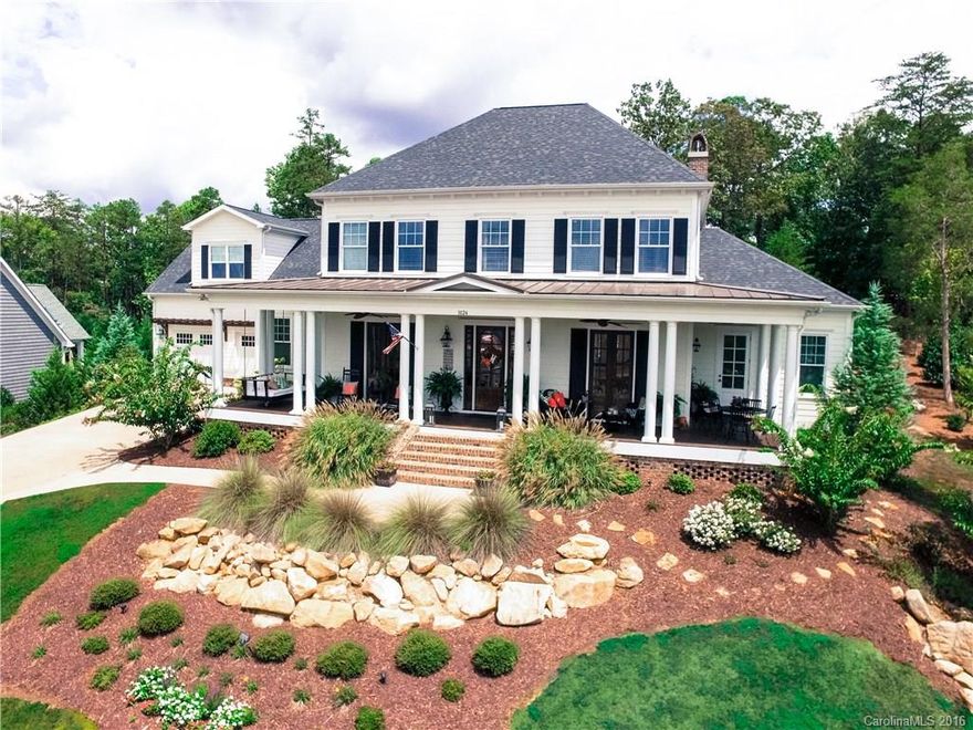 Impeccably finished custom home in Baxter's River District. This meticulously designed property is out of a southern living magazine. 4BR with possible 5th BR or playroom. Home theatre/game room. Gourmet kitchen w/ custom cabinets, exceptional granite, custom butcher block, high-end appliances & brick fireplace. French doors lead to a huge front porch. Downstairs master w/ lux bath & freestanding tub. Barn doors, coffered ceilings, custom built-ins, drop zone cubbies & heavy moulding throughout.