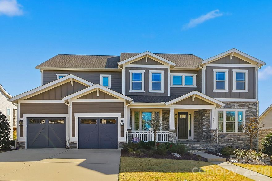 Designer Living in the Heart of Masons Bend! Welcome to 2549 Hidden Shoals Road, where thoughtful design meets elevated everyday living in one of Fort Mill’s most sought-after communities. Built by Fielding Homes, this stunning 5-bedroom Harmony plan offers over 4,300 square feet of beautifully curated space, blending timeless architecture with modern designer finishes throughout. From the moment you step inside, you’re greeted by rich wood flooring, custom finishes, and an open-concept layout that feels both sophisticated and inviting. The heart of the home is a chef’s kitchen featuring a gas cooktop, double ovens, an oversized island, a walk-in pantry, and a seamless flow into the great room, anchored by a gas fireplace. Head out to the expansive covered porch spaces, creating effortless indoor-outdoor living, perfect for entertaining or quiet evenings at home. The main-level guest suite offers privacy and retreat-style comfort, while the upper level features a luxurious primary suite, spacious secondary bedrooms, a bonus room, and thoughtfully designed functionality for everyday living. Situated on a fenced .31-acre homesite, this property is just steps from Masons Bend’s exceptional amenities, featuring a clubhouse, fitness center, resort-style pool, playground, and scenic walking trails, and just moments from the banks of the Catawba River. Morning walks, afternoons at the pool, and evenings on the wraparound porch create a lifestyle that feels both active and relaxed. Ideally located just minutes from I-77, this home offers convenient access to Downtown Fort Mill, Uptown Charlotte and Charlotte Douglas International Airport, making commuting, travel, and city amenities effortlessly accessible while still enjoying the serenity of riverfront community living. In Masons Bend, you’re not just buying a home, you’re embracing a way of living!