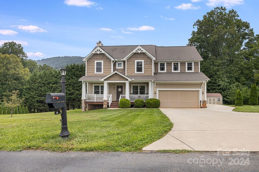 This absolutely beautiful home is located on a large spacious grassy lot that boasts a saltwater pool, plenty of space for outdoor activities and entertaining, and year-round views. The well-maintained landscaping adds to the home's curb appeal and provides privacy. The main level features an open floor plan with lots of natural light, a stone fireplace, an office and a half bathroom. The kitchen features ample cabinet storage, stainless steel appliances, a pantry and a built-in desk. Located upstairs the large master bedroom features a custom-built closet and vaulted ceiling. The 2-car garage offers plenty of space, and there is an additional storage building if you need more. Well-built and tastefully updated. The large bonus room could be a 5th bedroom. The interior walls and cabinets have been recently painted as well as carpets being replaced. It is conveniently located in South Asheville and just minutes from Biltmore Park, the Asheville Airport, and the Blue Ridge Parkway.