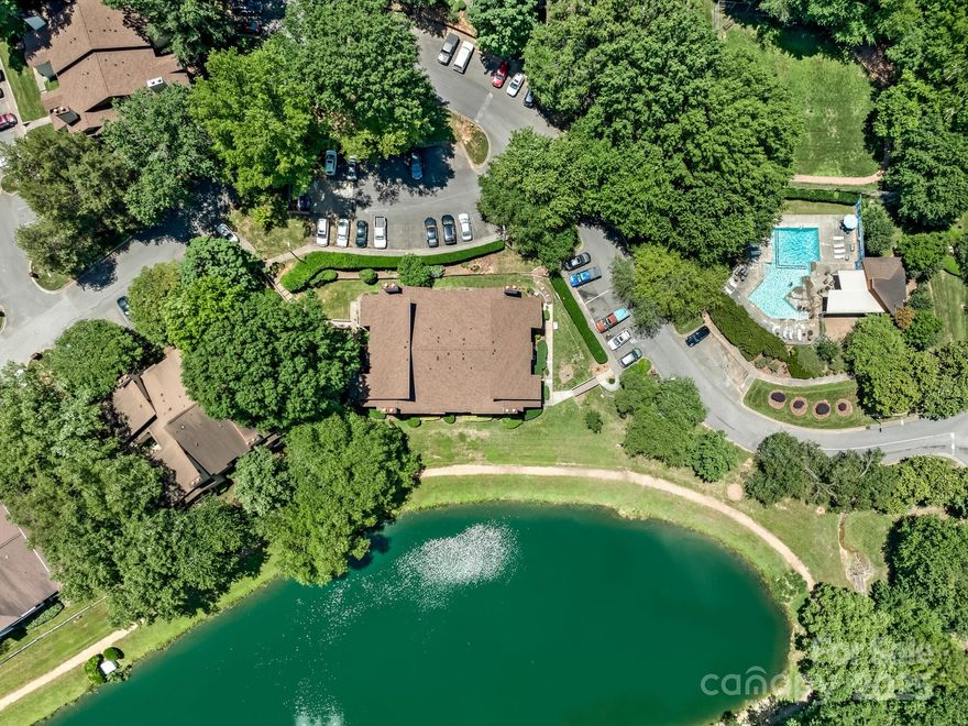 Spectacular condo completely updated! Gorgeous kitchen offers beautiful marble counters & bar area, perfect for a couple of barstools. Also included- a large farm/apron sink, tile backsplash, stainless appliances & pantry! Small area for dining in the kitchen, ideal for a bistro table. Additional dining space opens to LR & overlooks spacious, private covered porch. Nice sized BR's feature generous storage. Both baths have been completely updated! The guest bathroom features beautiful engineered stone counters & 3x6 beveled white subway tile surround w/a Carrara marble niche in the tub/shower combo. Primary bath offers a w/in shower w/porcelain tile & a custom porcelain tile niche. Freshly painted, new lighting, porcelain tile floors in the laundry closet & primary bath, & new vinyl wood plank flooring throughout the main living areas. New roof in 5/2024! New HVAC (heat pump) replaced in 6/24!