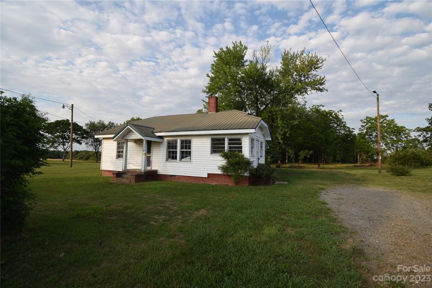 Nice property with 2.78 acres (per deed.) Nice level lot with good road frontage on a corner lot. A portion of the lot (right side) had a SW mobile home and there is a 4 bedroom septic for the single wide. The County could not locate the Septic permit for the house that is on the property. There is a 2 bed 1 bath home in need of a total rehab. You could potentially bring in another MH and place where the prior SW was and rehab the house and have 2 rentals. You could potentially divide the land and have 3 lots depending on perc (new constructions is located across Grigg Rd. and along Cat Square Rd.) Or you could demo the house that is there and build 1 new home. Lots of potential! Property to sell as is where is with all faults and anything in the home on closing day will convey with the property. Seller have never lived in the home. Per Seller utilities turned off approx 12 months ago. Seller prefers not to turn utilities on to the property.