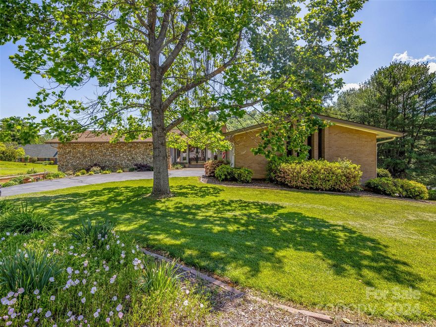 Nestled within a picturesque setting in the golfing community of Crooked Creek, located in Hendersonville, NC, this stunning brick home is a testament to elegance and comfort. Spanning over 4,000 square feet, it boasts a majestic presence with three exquisite fireplaces lending warmth to its inviting ambiance. As sunlight floods through large windows, casting a gentle glow upon the interior, you'll be captivated by the breathtaking mountain views that serve as a backdrop to this splendid abode.  Imagine mornings spent savoring a cup of coffee on the deck or evenings unwinding on the screened porch, surrounded by meticulously manicured landscaping that evokes a sense of tranquility and serenity with great views of the golf course while on your deck. But the wonders don't end there. This esteemed neighborhood includes access to a tranquil fishing lake, perfect for leisurely afternoons casting a line or simply enjoying the peaceful surroundings.