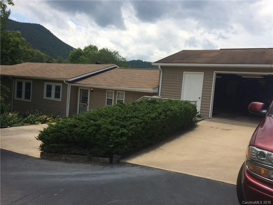 Constructed with 2/ servant homes from the Biltmore Farms and assembled together in the 1950's. Upgraded with storm windows and doors, 1-1/2 year old roof. Well maintained with a 3 car attached garage. Comes with an extra mobile home that  can be rented, plus 3 Mobile Home ground lots on the property bringing an income of approx. $1100. dollars per month. . Small barn and shed. Each Mobile has its own septic and water is furnished from the private well.