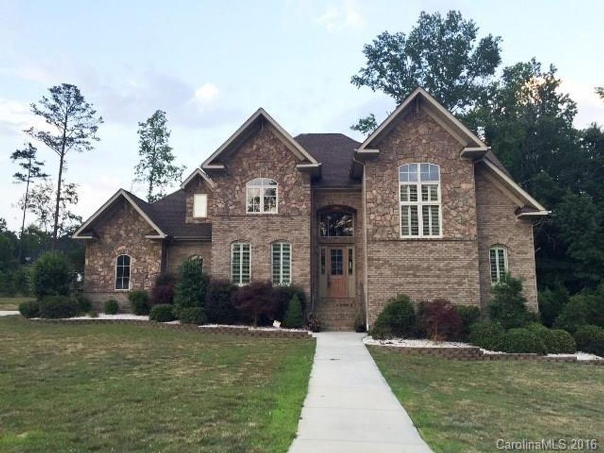 Just reduced! One of a kind all brick w/ stone custom build in Miller Pond Phase 2. Home features formal dining, spacious great room w/plantation shutters and hardwoods thru-out the main. Pamper your household chef with this dream kitchen designed to entertain w/ granite counters, work island w/sink, and breakfast bar! Master suite downstairs offers massive walkin and garden tub. Second floor houses three additional bedrooms, a raised study/den. Beautiful deck w/ wooded view for extra privacy!