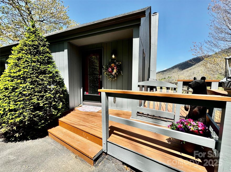 Experience breathtaking views of the Black Mountains while you sip your morning coffee from the wrap-around deck and living areas!  Watch the sun set over majestic peaks and a quiet creek. This stand-alone townhouse has its own little fenced-in yard and is not connected to any other townhouses.

This townhouse is near Roaring Fork Falls, the South Toe River, and hiking trails. Enjoy privacy with a bedroom and full bath on each level. You could potentially have three master suites.

The living area features a stone fireplace, picture windows for viewing the clouds and mountains, a large dining area, and a cozy kitchen with plenty of cabinets. You will fall in love with the views from every level. 

Luxury vinyl plank flooring was installed in 2024 in the upstairs, lower level, and main level bedroom. All of the interior walls and trim were painted in 2025. New roofs were put on all of these townhouses in 2025. Plus, enjoy two exterior storage areas, as well as ample storage in the basement. Second floor includes a loft area that makes a great office.

Lawn care and snow removal are included in the HOA fee. This fun escape is perfect for year-round living -- or as a short-term or long-term rental.  Move-in ready. Amazing price!  (Broker owned.)