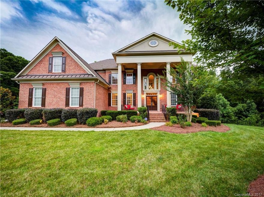 Full Brick 2 Story w/Basement John Wieland Home on a Quiet Cul-de-Sac Lot located in The Woods section of Bridgemill. Grand Curved Staircase in 2 Story Entry, Hrdwoods in Entry, DR, LR, Kitchen, Brkfast Area & Mud Room, Guest Suite w/Full Bath on Main Level, Kitchen includes Granite w/Tile Backsplash, Lrg Center Island & Honey Maple Craft Cabs w/detailed Rope Trim, Oversized Custom Master Closet, Luxury Master Bath, Basement includes Theatre, Rec and Exercise Rms & Lots of Storage!! 3 Car Garage