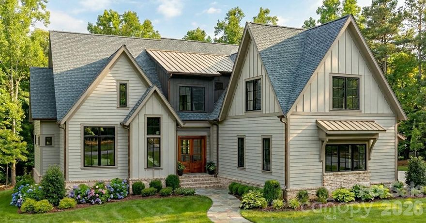 Nestled on over 2 acres of lush, private land in the prestigious Bella Ridge community, this award-winning home by Copper Builders boasts unparalleled craftsmanship and sophisticated design. With 4,878 sq. ft. of heated living space, this expansive home offers 5 bedrooms and 6 bathrooms, ensuring ample room for both family and guests.

The first floor features an elegant great room with a gas fireplace, a chef-inspired kitchen with custom cabinetry and premium appliances, and a formal dining area. The master suite, located on the main floor, offers a luxurious retreat with a spa-like bath, expansive walk-in closet, and private access to the stunning covered porch.

Upstairs, you'll find spacious secondary bedrooms, a bonus room, and a media room designed for comfort and relaxation. The open floor plan with vaulted ceilings and expansive windows provides breathtaking views of the beautifully landscaped property. A 3-car garage and a mudroom with built-in lockers provide excellent convenience.

Step outside to your private oasis where a covered porch and outdoor gas fireplace invite relaxation and entertainment. This is truly a one-of-a-kind propertyon a 2+ acre homesite, offering luxury living in Fort Mill, South Carolina, just minutes from top-rated schools, shopping, and dining.