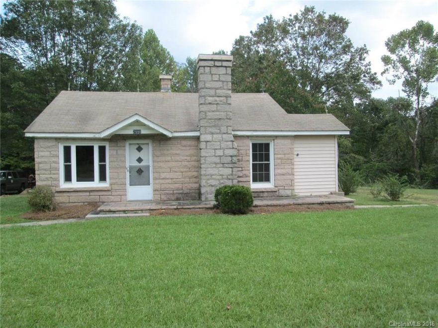 Hard to find Unique Pink Granite 1 Story home with 2 acres. The land is mostly flat and very usable. The exterior has a Granite picnic table and 2 Granite pedestal tables built into the yard. The interior has 3 bedrooms and wood burning fireplace in 2 bedroom. The home has a nice size kitchen. this home is located close to Jake Alexander Blvd and I-85. Home is close to schools and shopping. This home will not last long with this amazing Pink Granite exterior.