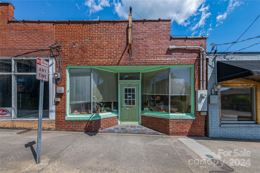 Located in the heart of Marion's bustling Historic Downtown, these three adjoining properties offer a rare opportunity for investors or businesses looking to establish a presence in a expanding community. With a combined frontage of 150 feet on State Street, these properties boast excellent visibility and accessibility, making them ideal for retail, office space, or mixed-use development. In addition to the 3 parcels is a separate pin that includes parking or can be used to build a separate structure. Don't miss out on this exceptional opportunity to acquire prime commercial real estate in Marion NC. 39 offers a studio with kitchenette, bath and living area. 41 is currently an Art studio with full bath and kitchenette. 43 is a beautiful private garden area with back access to a convenient parking lot, or use the parking space to build a structure. Ideal retail, small deli or cafe with outdoor seating. Building can be combined to open up floor space.
