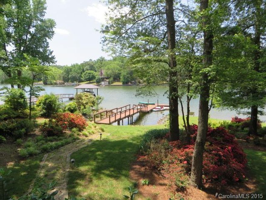 ENJOY TRANQUIL VIEWS OF LAKE WYLIE FROM EVERY ROOM OF THIS SPACIOUS WATERFRONT HOME! Private, wooded setting on .53 acres. Circular drive. Floating dock & pier. Deep water. 2 decks. Great Room has stunning wall of windows to the outdoors + 2 story stone FP & bookshelf/wet bar. 1st floor Master w/ 2nd FP, deck access & bath w/oversized shower & cedar closet. Kitchen w/granite ctrs, ss appl & loads of storage. Relax & dine in either the Brk Nook or formal DR w/ the lake as your backdrop!
