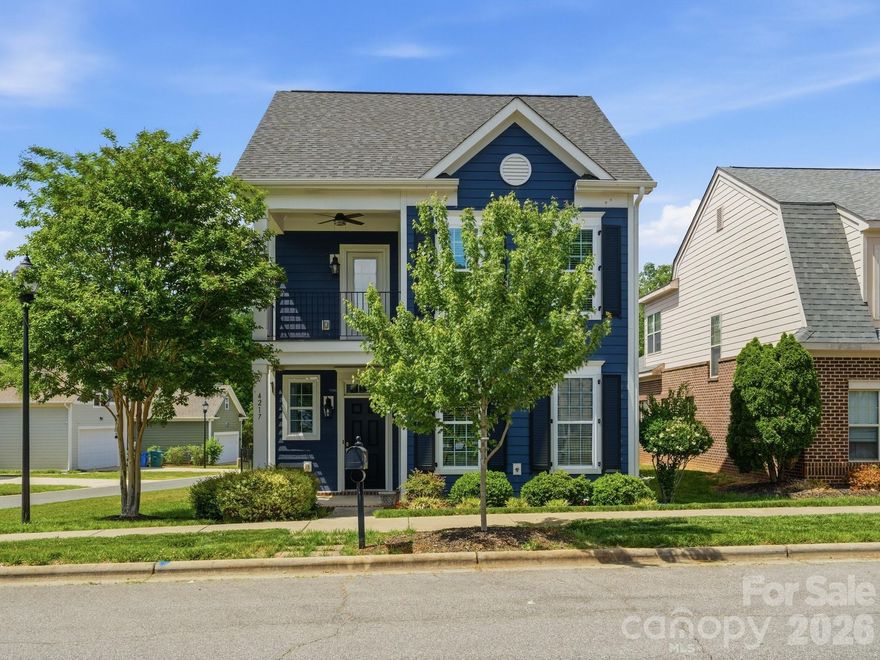 Charming and well-maintained home in the desirable Brighton Park community of Mint Hill, ideally situated on a corner lot across from neighborhood green space. Built in 2017, this 3-bedroom, 2.5-bath home offers a bright and functional layout with thoughtful details throughout. The main level features an open-concept living, dining, and kitchen area filled with natural light. The kitchen is equipped with quartz countertops, a large island, gas cooktop, wall oven, tile backsplash, under-cabinet lighting, pantry, and a built-in nook with additional cabinetry and beverage fridge. The primary suite is located on the main level and includes a spacious bathroom with double vanity, semi-frameless shower with bench and linen closet. A custom walk-through closet connects directly to the laundry room for added convenience. A half bath is also located on the main level. Upstairs offers two additional bedrooms, a full bathroom, and a versatile loft space. One bedroom features access to a private balcony. Additional highlights include double front porches, a fenced yard, side patio, walk-in attic storage, and a 2-car garage. Brighton Park offers pocket parks and trails throughout the community with walkability to shops and restaurants. Additionally, Ezell Park is a brand new 91-acre park just minutes away. 

Convenient Mint Hill location with charming curb appeal and functional living spaces.