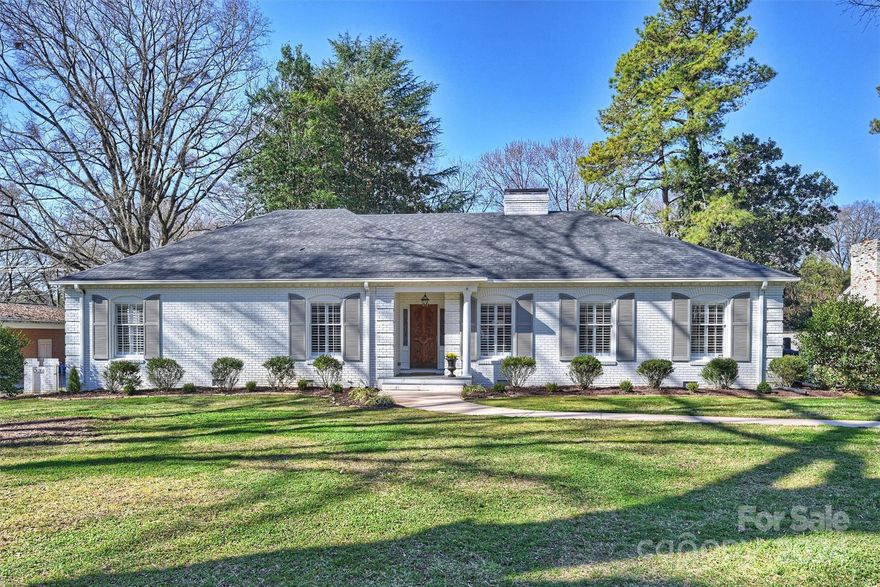 This beautiful brick ranch is ready for its new owners! Located in desirable Lansdowne on a fantastic, flat 1/2 acre lot, this 4BR/2BA home has all the charm and character you are looking for. Gorgeous hardwoods, plantation shutters, updated light fixtures. Large living and dining room, ready to entertain. Bright, sunny, beautifully renovated eat-in kitchen. Inviting den with wood-burning fireplace leads to great all-season sunroom. Generous primary bedroom with updated bath, double closets. Deep, fully fenced back yard perfect for entertaining and playing. Plentiful storage adjacent to carport with a large workshop/add'l storage behind.  Exterior freshly painted in 2023. Known for its wide, tree-lined streets, Lansdowne's coveted location has easy access to SouthPark, Cotswold, Uptown, and Matthews. Just a short walk or bike ride to the new Lansdowne Elementary or Providence Day.