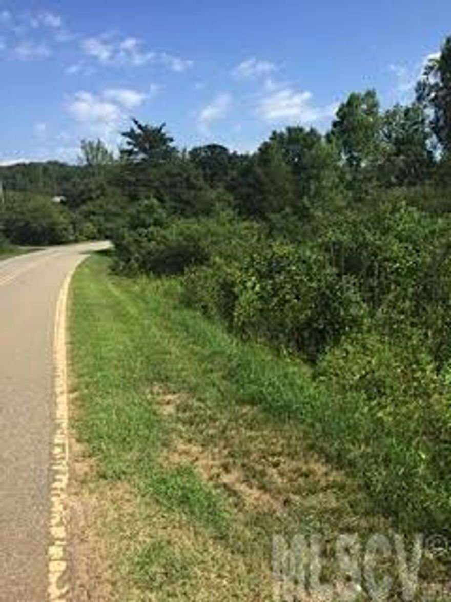 The lot gently slopes making it a perfect mobile home site or for a single family with a basement! Subject property backs up to a community pond.