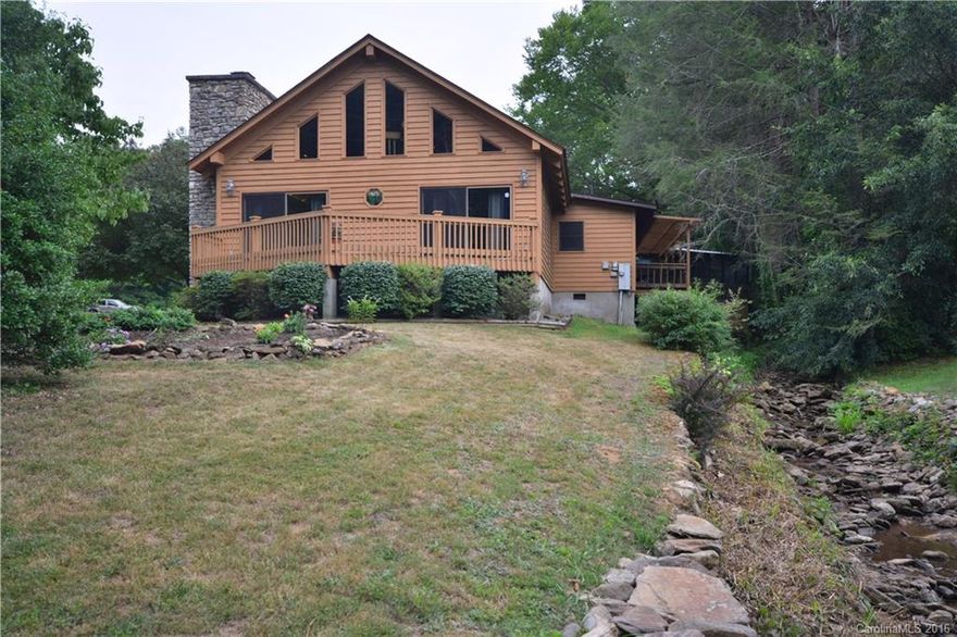 Rushing streams on two sides of the property with covered front porch, back deck and screened in gazebo with hot tub all taking advantage of the streams.  Large rock wood burning fireplace to enjoy on the cold days in a large great room with cathedral ceiling.  Home has a two bedroom septic and the bedrooms are large, there is also a loft and an office for all those guests.  The home is handicapped access and has plenty of storage inside and out with a 10x14 storage building.