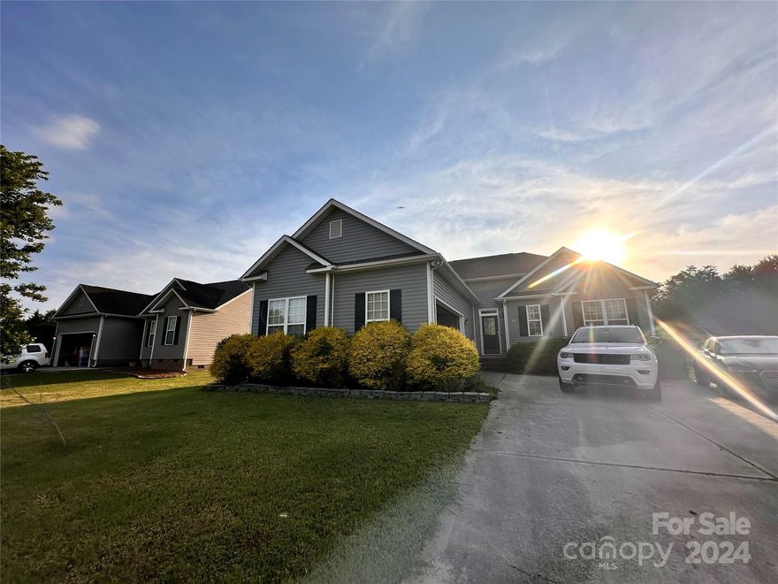 Pride of ownership beams from this 3 bedroom, 2 bathroom home in the friendly community of Steele Meadows. Wood floors welcome you and lead into a living room made cozy by a gas fireplace. Vaulted ceilings extend from the living room into a dining area lit by an elegant chandelier. Prepare meals in the kitchen outfitted with stainless steel appliances, gorgeous cabinetry, and a pantry. The primary bedroom showcases a tray ceiling, ample natural light, and an en suite bathroom complete with a garden tub, a separate tiled shower, dual sinks, and a walk-in closet. Split bedroom floorplan makes for great space and the backyard is fenced and ready! Super cute home ready for a new owner! This home offers a location close to schools, restaurants, entertainment, and I-77.