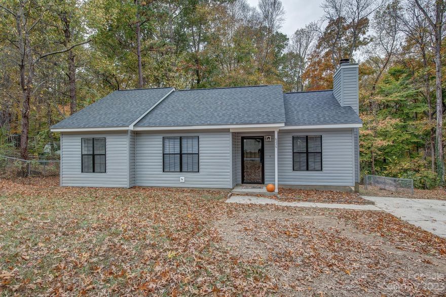 WELCOME HOME to this beautiful and freshly renovated 3-bedroom, 2-bathroom ranch. Move in ready featuring a nice open floor plan with vaulted ceilings in a large living room perfect for entertaining. The kitchen includes an abundance of cabinets, new countertops, stainless steel appliances, and dining area. Luxury EVP flooring throughout and all new light fixtures. Also includes a fully fenced and beautiful wooded area for your private back yard view. Short distance to grocery, restaurants, and schools.