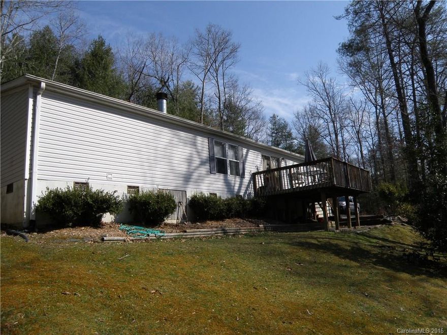 Large affordable home in a quiet, private setting with winter mountain views of neighboring Holmes State Forest. This large home has an open floor plan with wood burning fireplace, and a spacious kitchen which opens to the dining and living rooms. The master bedroom has a huge walk-in closet and private master bath with double sinks, a separate tub and shower. Large deck for BBQ and enjoying the outdoors. Gated paved driveway for added privacy.